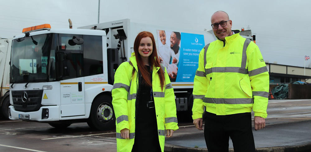 Photo of Heidi and Nigel by a refuse lorry
