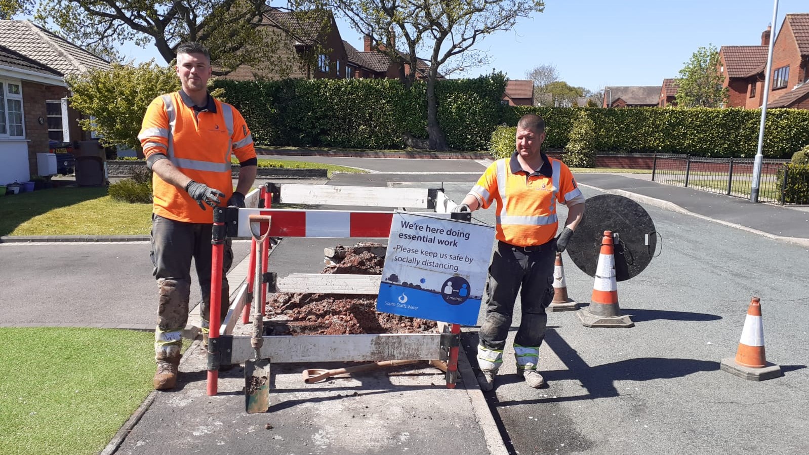 Photo of workers with a two-metre gap