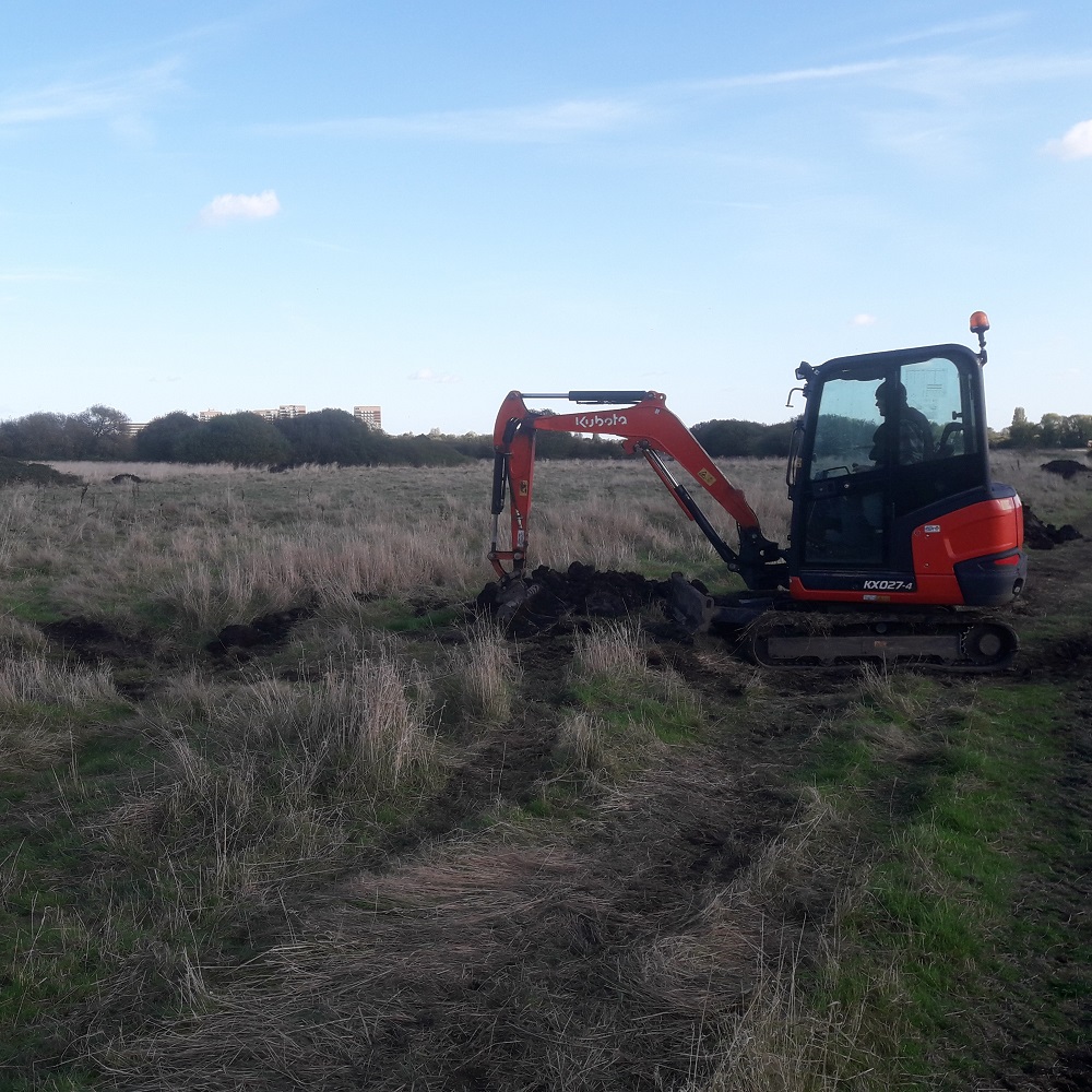 Photo of excavator carrying out the scrape